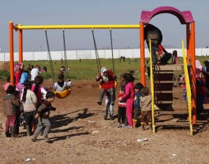 Syrian refugee children play at the Bab Al-Salam refugee camp in Azaz