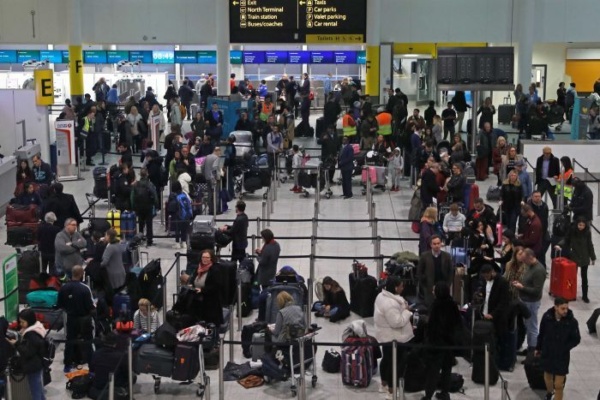 Passengers wait as Gatwick Airport is shut down by drones over the runway, December 2019