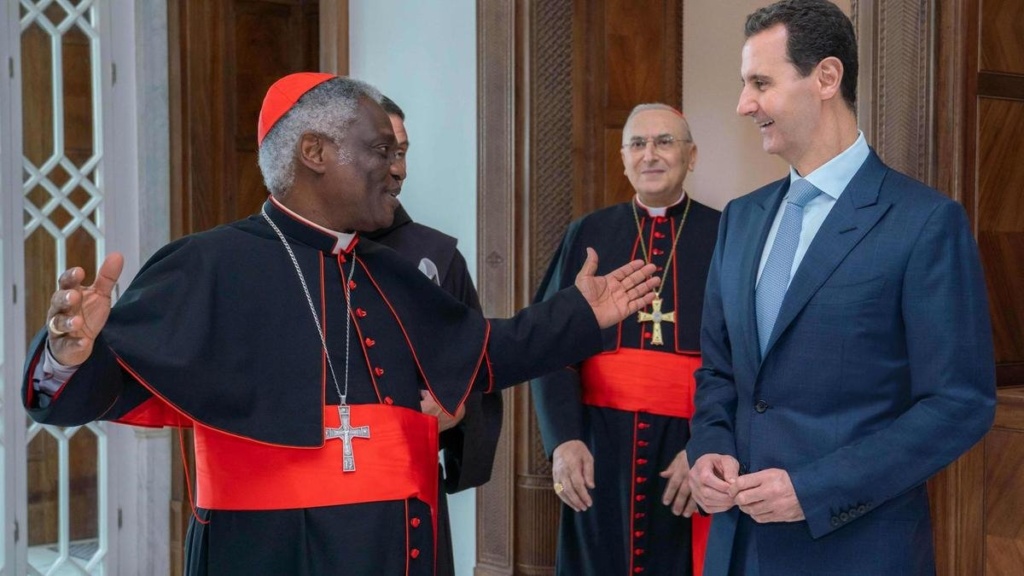 Cardinal Peter Turkson, the head of the Vatican's department for human development, with Syrian leader Bashar al-Assad, Damascus, July 22, 2019