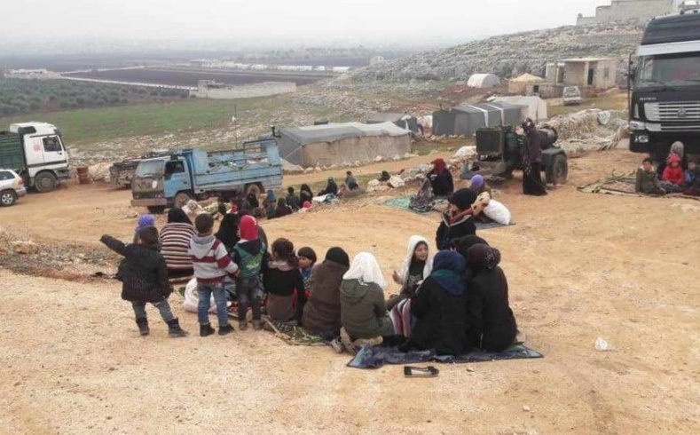 Newly-displaced women and children, forced to flee by Russia-regime attacks, in northwest Syria, December 23, 2019