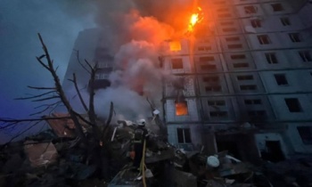 burning apartment block in Uman, where four civilians were killed and at least 17 were injured, after Russia's missile strike