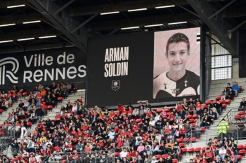 A tribute to Arman Soldin on the big screen of the Roazhon Park Stadium during the match between